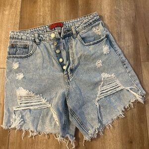 Distressed light denim shorts